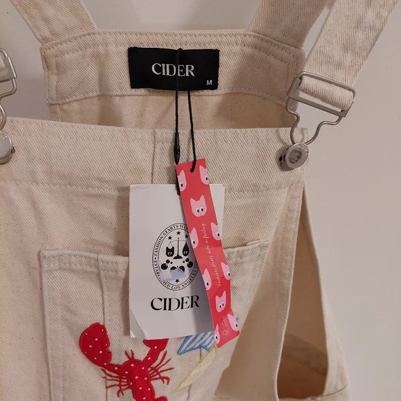 Cider Cream Overalls with Red and Blue Patches - Picture 3 of 5